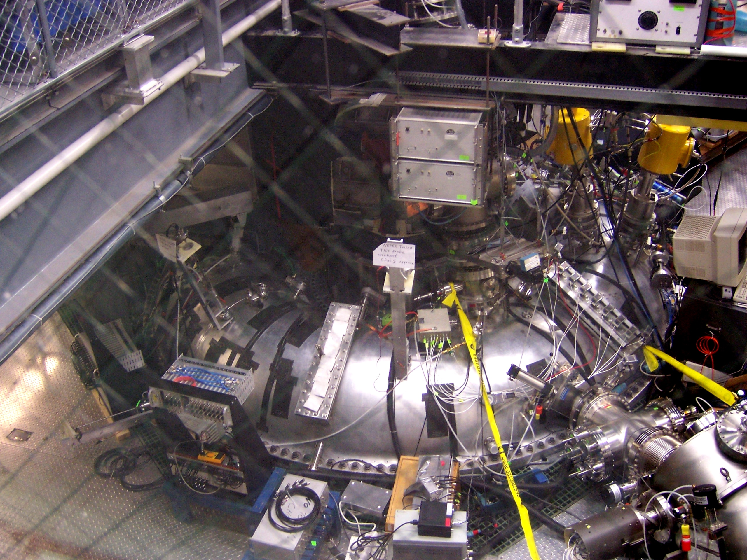 Large metal tube with various sensors, wires, and tools attached.