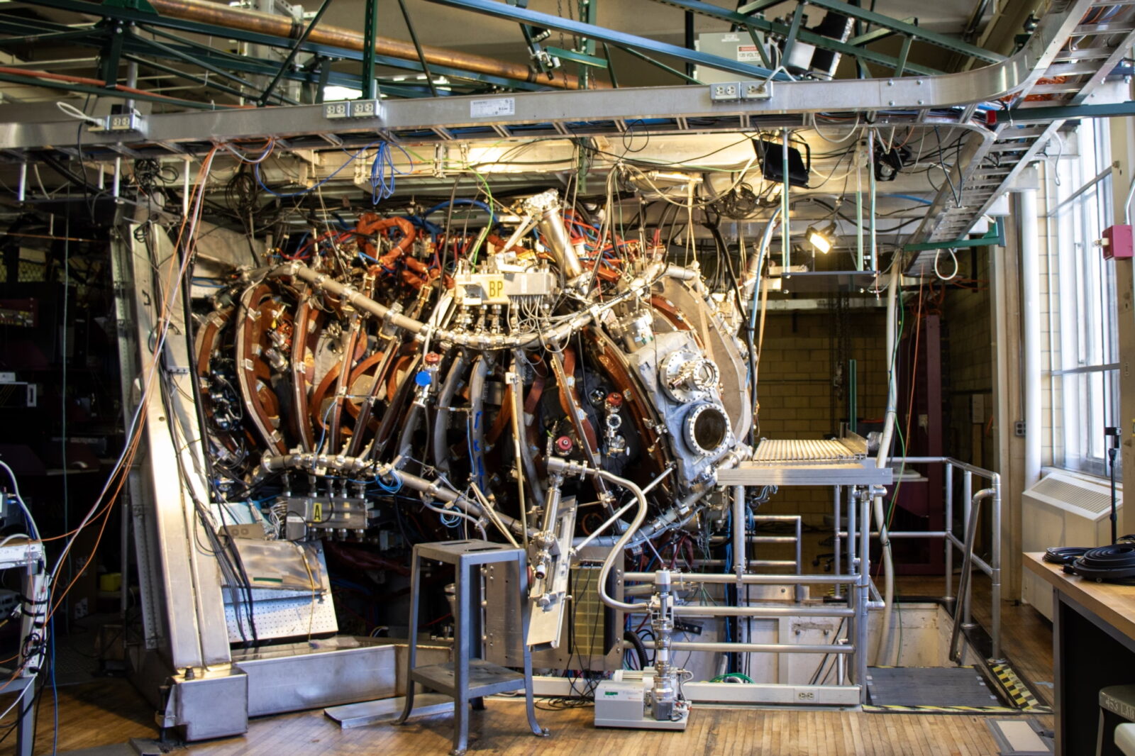 large piece of fusion science equipment with lots of intricate pieces holding it together