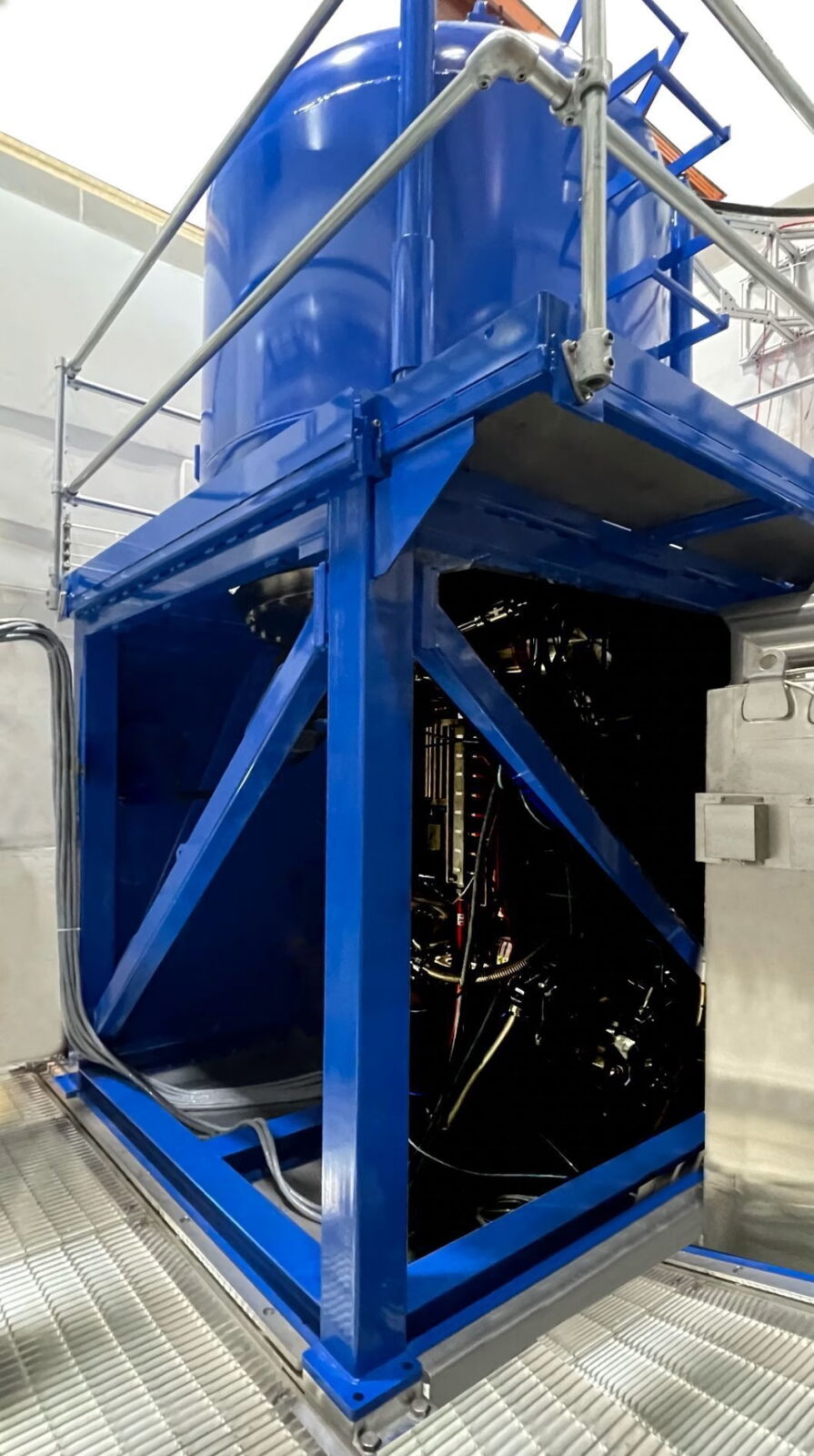 large piece of nuclear science equipment with a blue paint color
